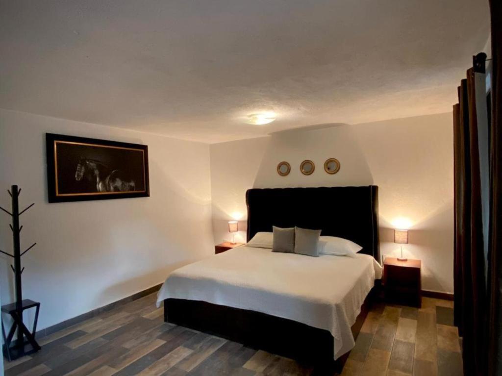 Postel nebo postele na pokoji v ubytování Cabañas, Suites y Habitaciones Rancho San Jorge