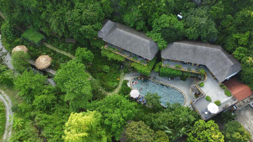 an overhead view of a house with a swimming pool at Trang An Ecolodge in Ninh Binh