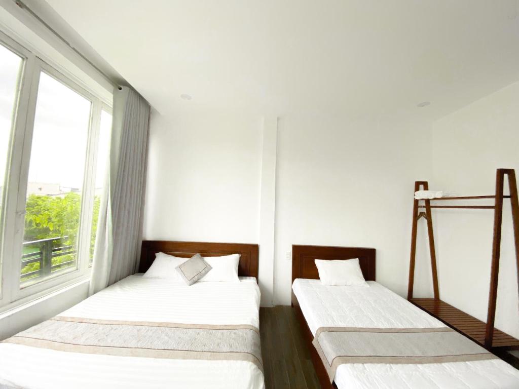 Postel nebo postele na pokoji v ubytování Hideaway Homestay