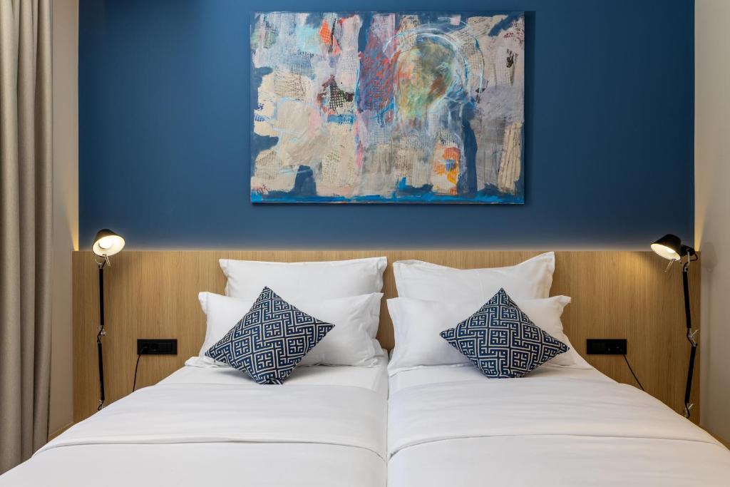 Postel nebo postele na pokoji v ubytování Emotheo Heritage Hotel