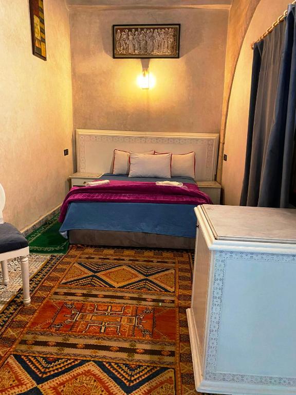 Postel nebo postele na pokoji v ubytování RIAD Tamazouzt