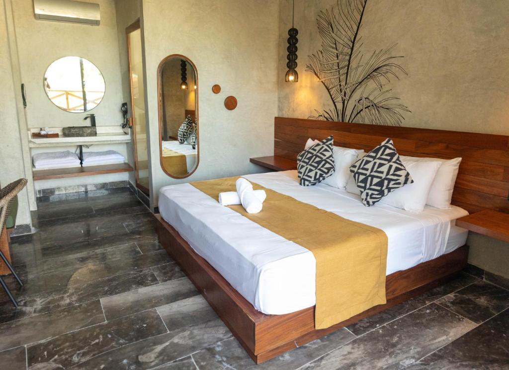 Postel nebo postele na pokoji v ubytování Hotel Sun Ha Bacalar
