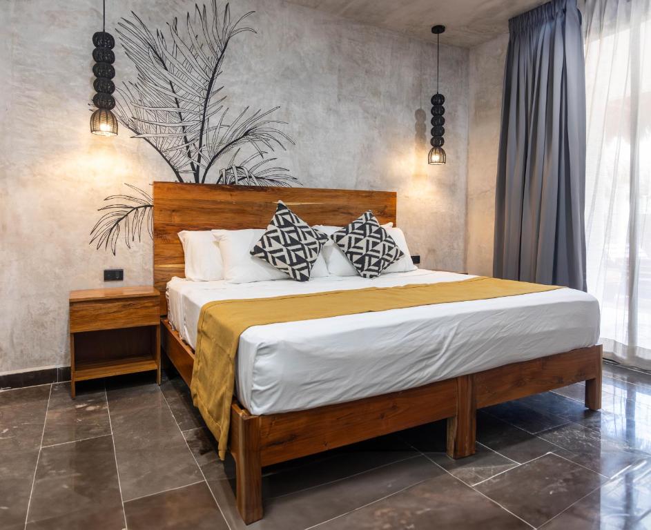 Postel nebo postele na pokoji v ubytování Hotel Sun Ha Bacalar