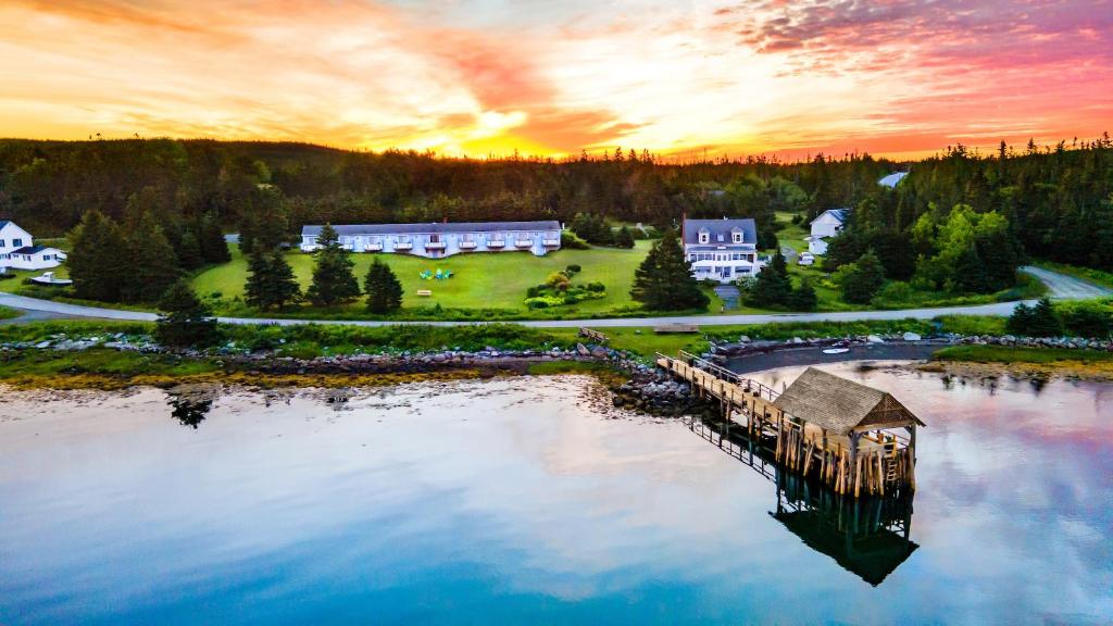 an aerial view of a house on a lake at The Marmalade Motel in Port Dufferin