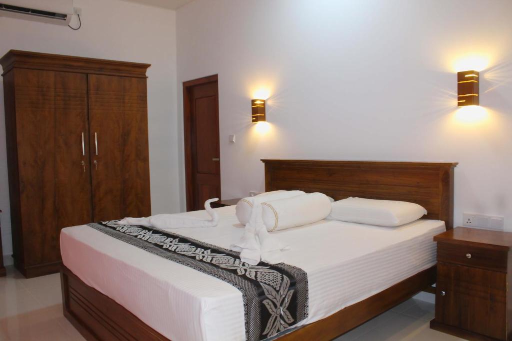 Postel nebo postele na pokoji v ubytování Villa Janaliya