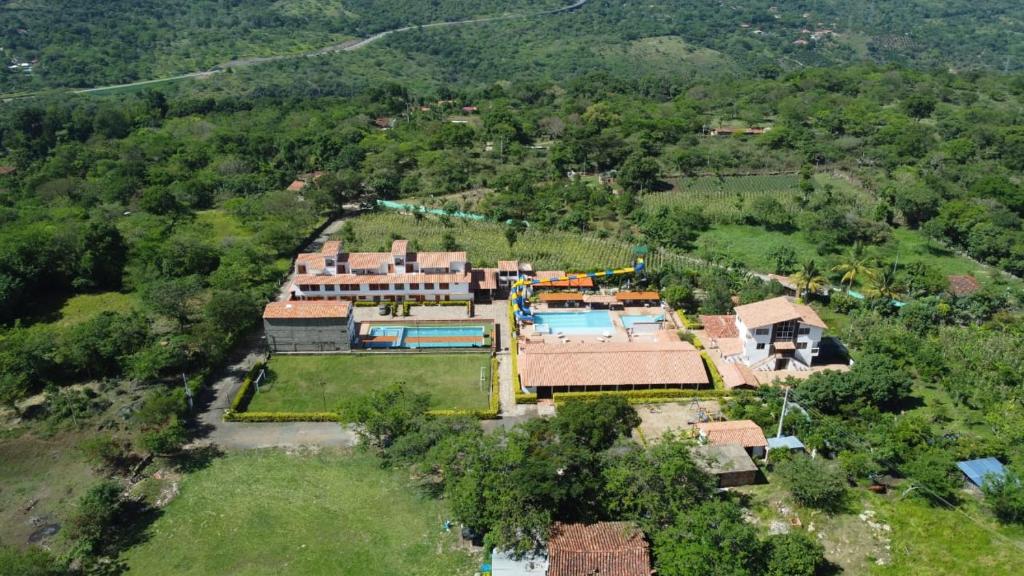 an aerial view of a house with a swimming pool at SAN GIL-Hotel Resort Campestre Puerta Del Sol in La Cabrera