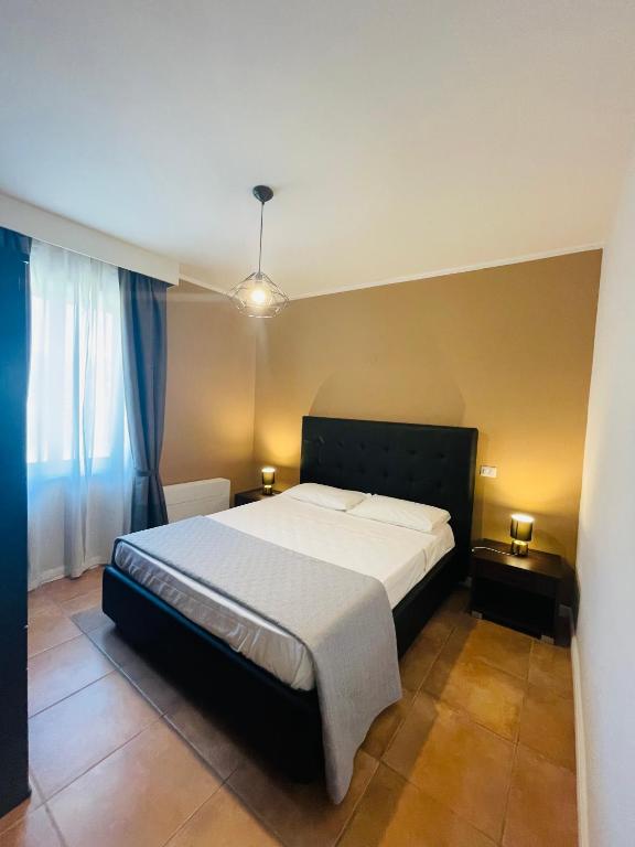 Postel nebo postele na pokoji v ubytování Conti B&B Suite Ponte Amato