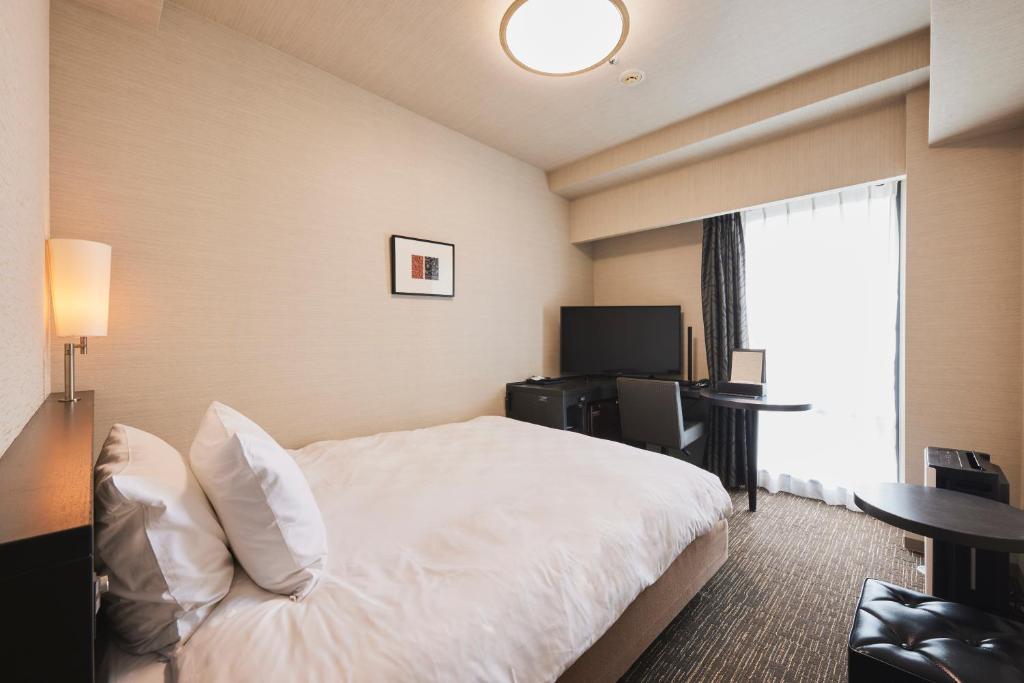 Tempat tidur dalam kamar di Richmond Hotel Nagasaki Shianbashi