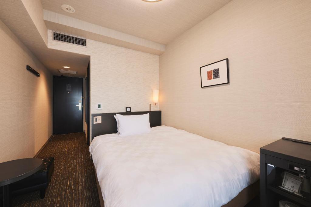 Tempat tidur dalam kamar di Richmond Hotel Nagasaki Shianbashi