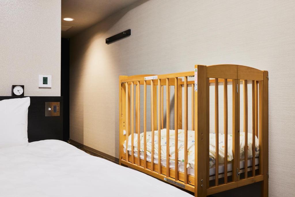 Tempat tidur dalam kamar di Richmond Hotel Nagasaki Shianbashi