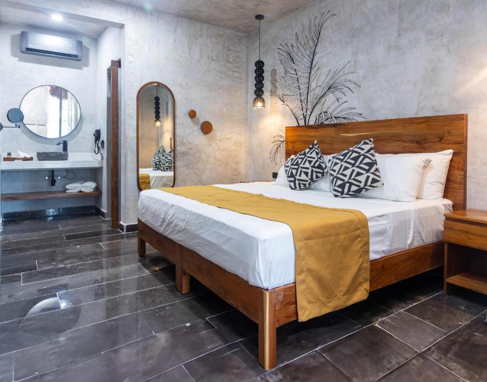 Postel nebo postele na pokoji v ubytování Hotel Sun Ha Bacalar