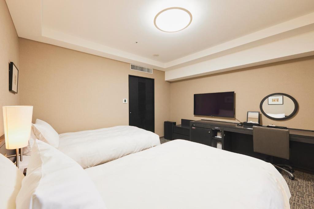 Tempat tidur dalam kamar di Richmond Hotel Nagasaki Shianbashi