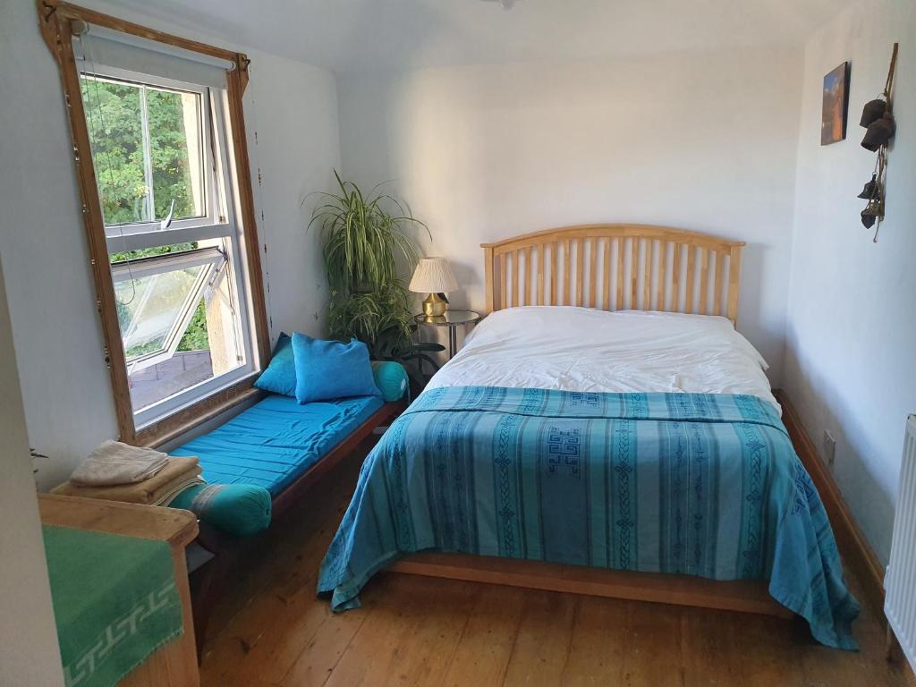 a bedroom with a bed and a window at No 23 in Kent