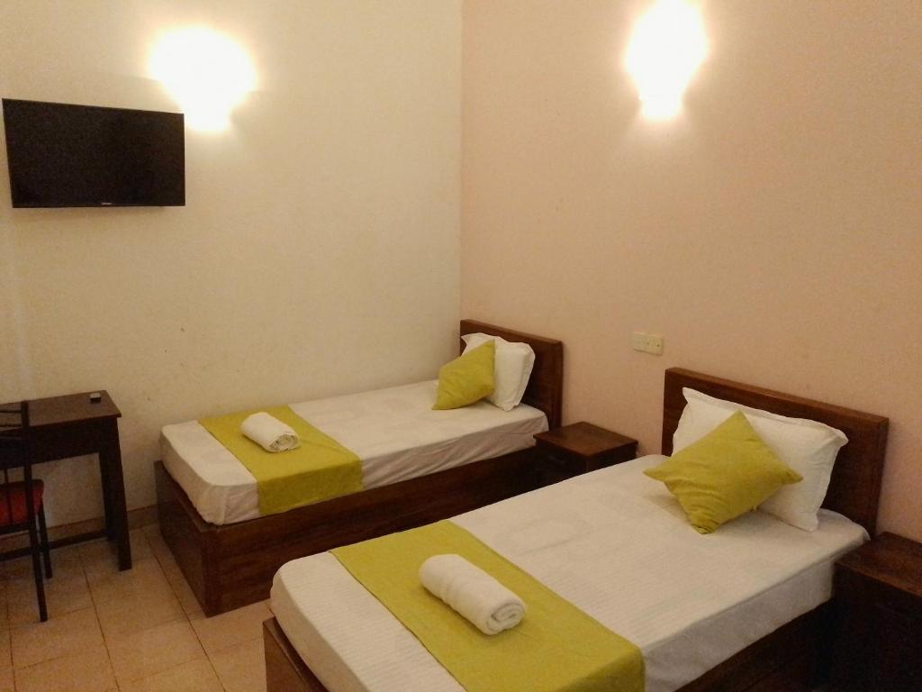 Postel nebo postele na pokoji v ubytování Paradise Residence Hanthana