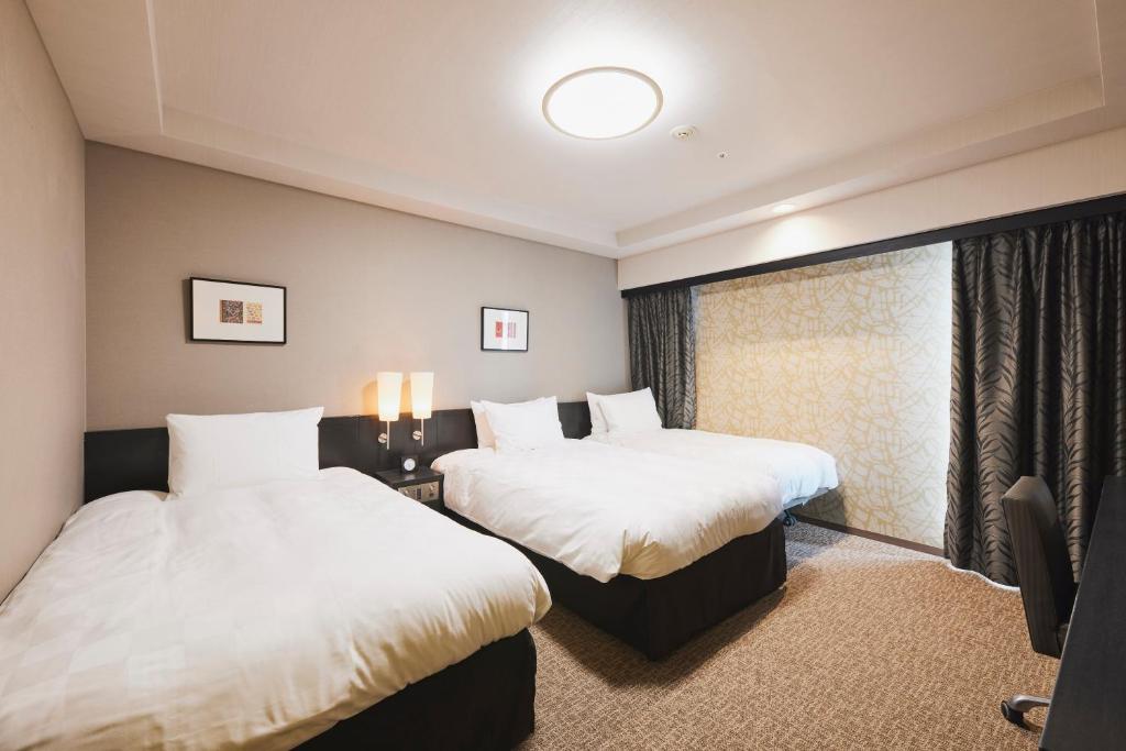 Tempat tidur dalam kamar di Richmond Hotel Nagasaki Shianbashi