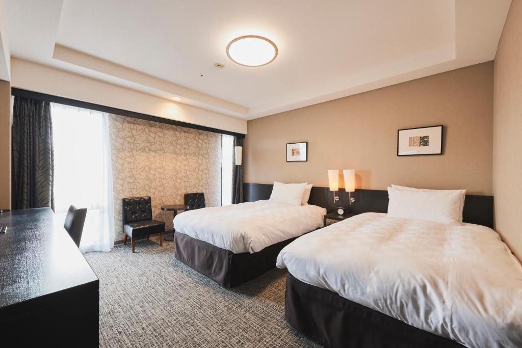 Tempat tidur dalam kamar di Richmond Hotel Nagasaki Shianbashi