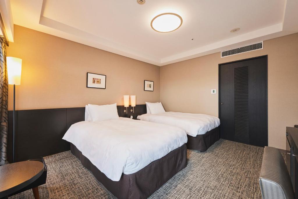 Tempat tidur dalam kamar di Richmond Hotel Nagasaki Shianbashi