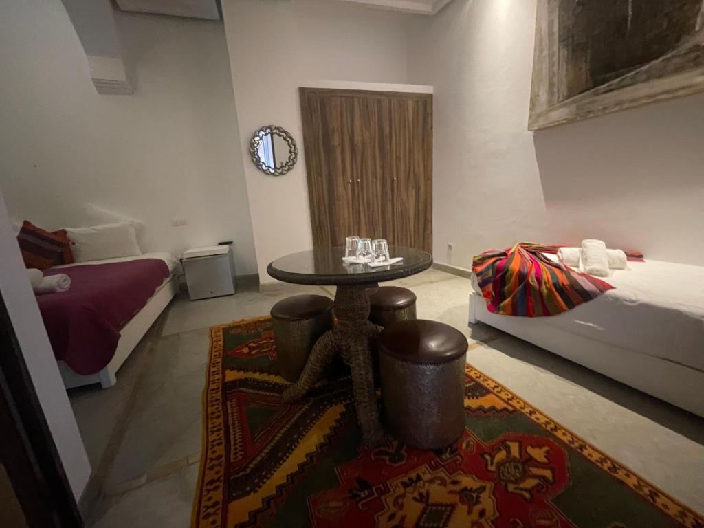 Postel nebo postele na pokoji v ubytování Riad Samarine