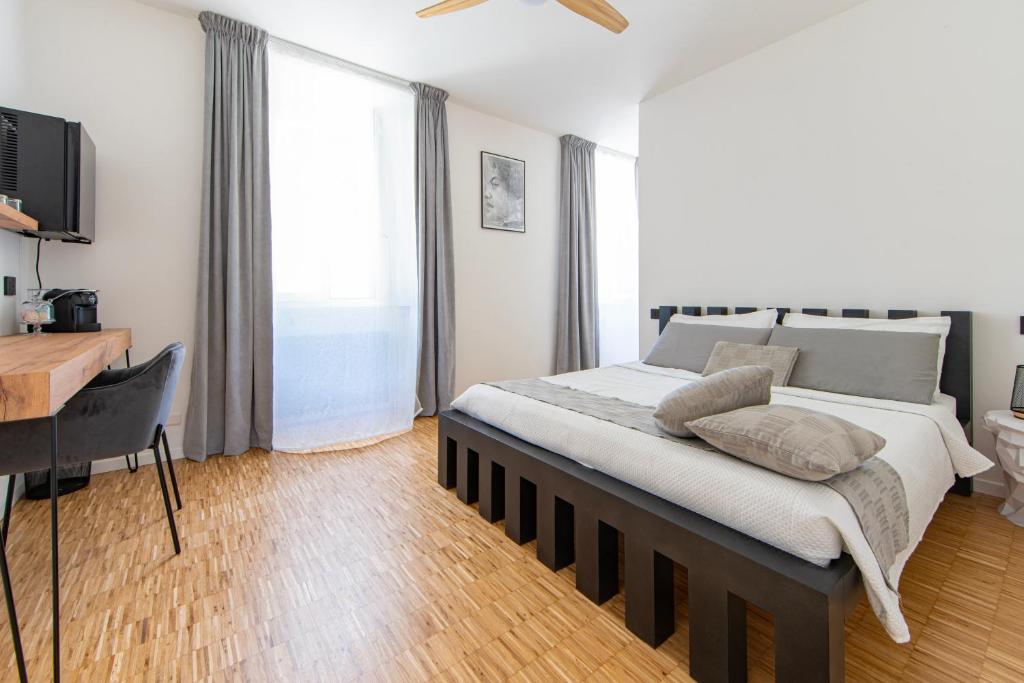 Postel nebo postele na pokoji v ubytování Cavaedium Guest House