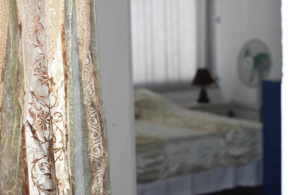 Una cama o camas en una habitación de Sunset Hostel