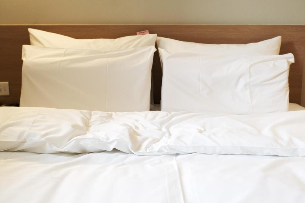 Postel nebo postele na pokoji v ubytování Aank Hotel Incheon Songdo