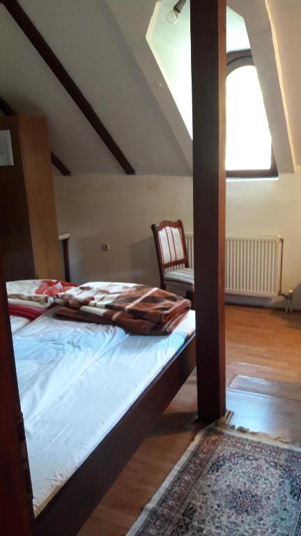 a bedroom with a bed in a attic at MS Stojic in Nova Varoš