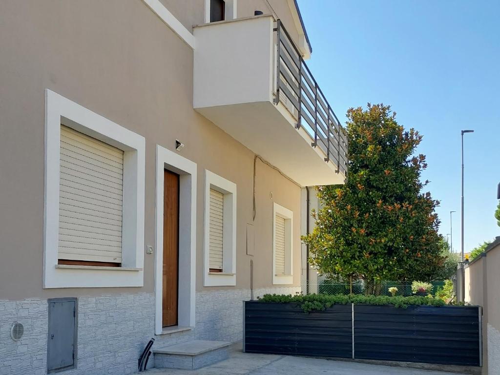 a house with a balcony on the side of it at ViaProperzio8 in Foligno