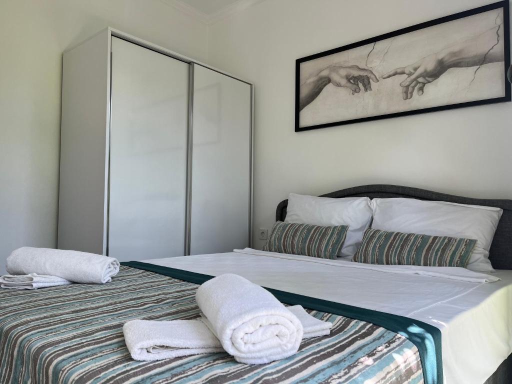 Postel nebo postele na pokoji v ubytování Kagan Holiday Apartments