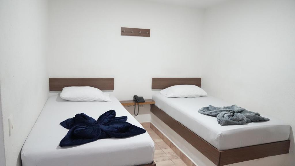 Postel nebo postele na pokoji v ubytování Hotel Salamanca Resort