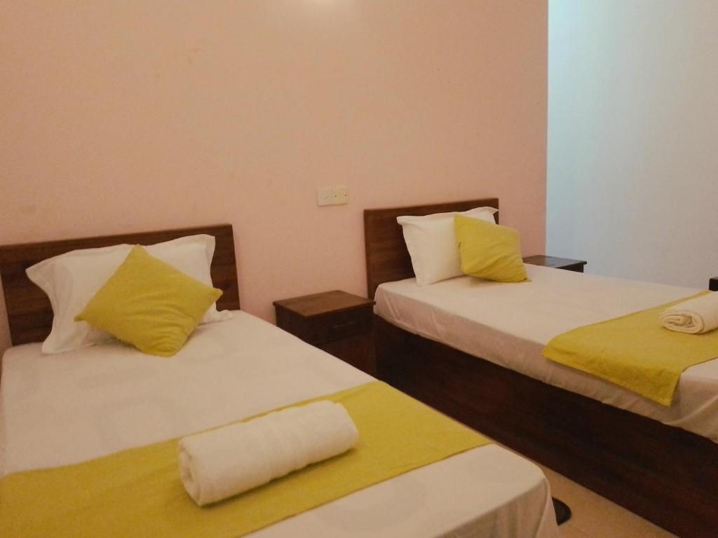 Postel nebo postele na pokoji v ubytování Paradise Residence Hanthana