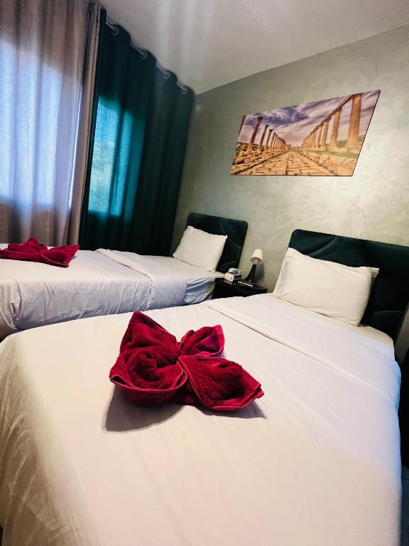 Postel nebo postele na pokoji v ubytování Sandra Hotel
