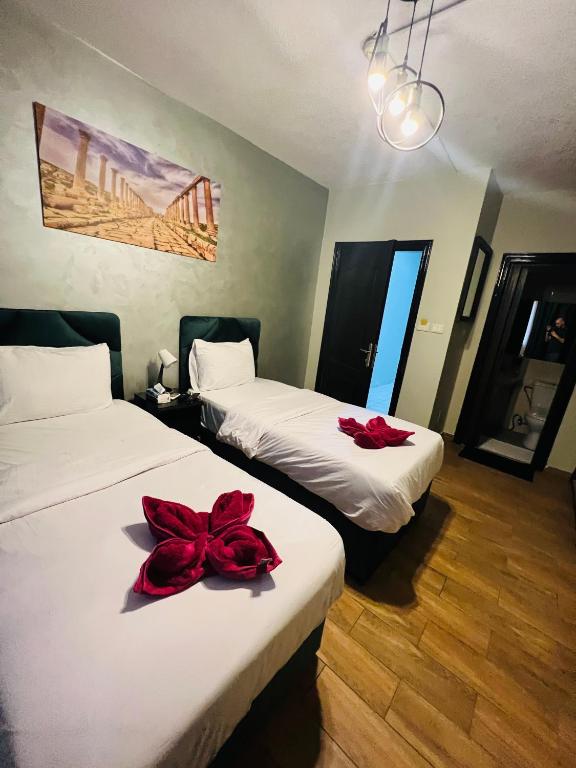 Postel nebo postele na pokoji v ubytování Sandra Hotel