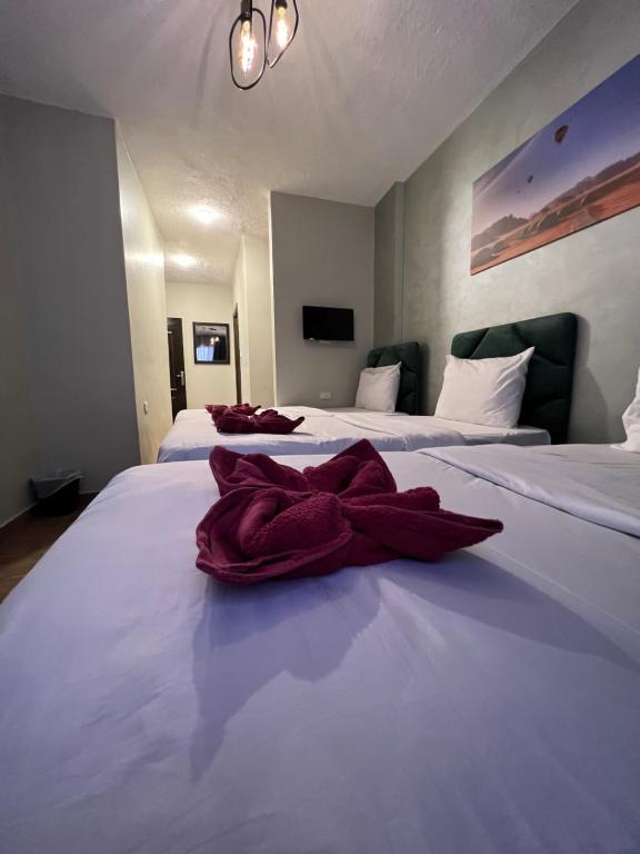 Postel nebo postele na pokoji v ubytování Sandra Hotel