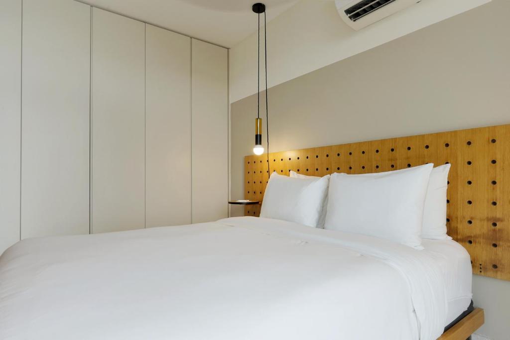 Postel nebo postele na pokoji v ubytování La Moderna by Wynwood House