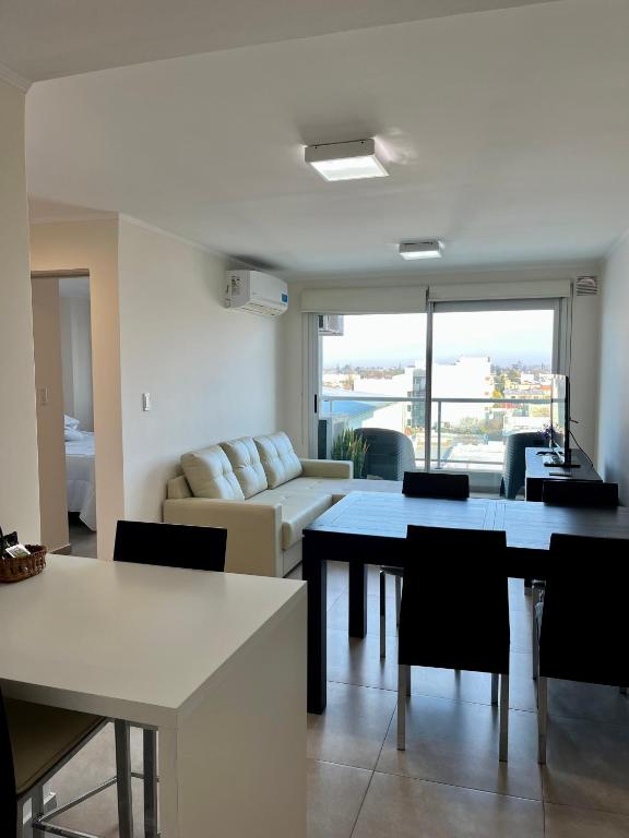 a living room with a table and a couch at Departamento céntrico en Rafaela in Rafaela