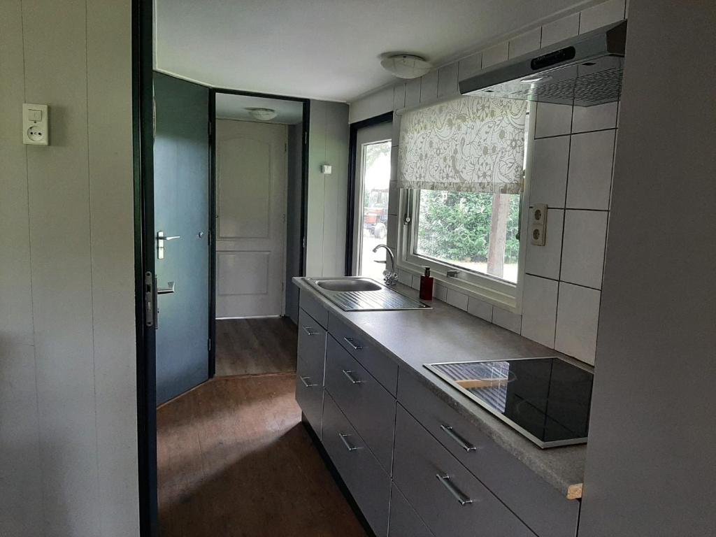 Kuchyň nebo kuchyňský kout v ubytování Pak oe rust, bij stacaravan Busscher