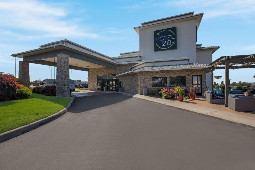 a building with a sign on the side of a road at Hotel 28 Boise Airport, an Ascend Collection Hotel in Boise