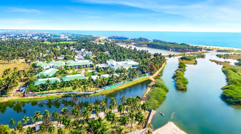 an aerial view of a resort next to a river at Radisson Resort Pondicherry Bay in Puducherry
