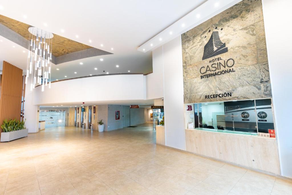 a large lobby with a sign for the casino restaurant at Hotel Casino Internacional in Cúcuta