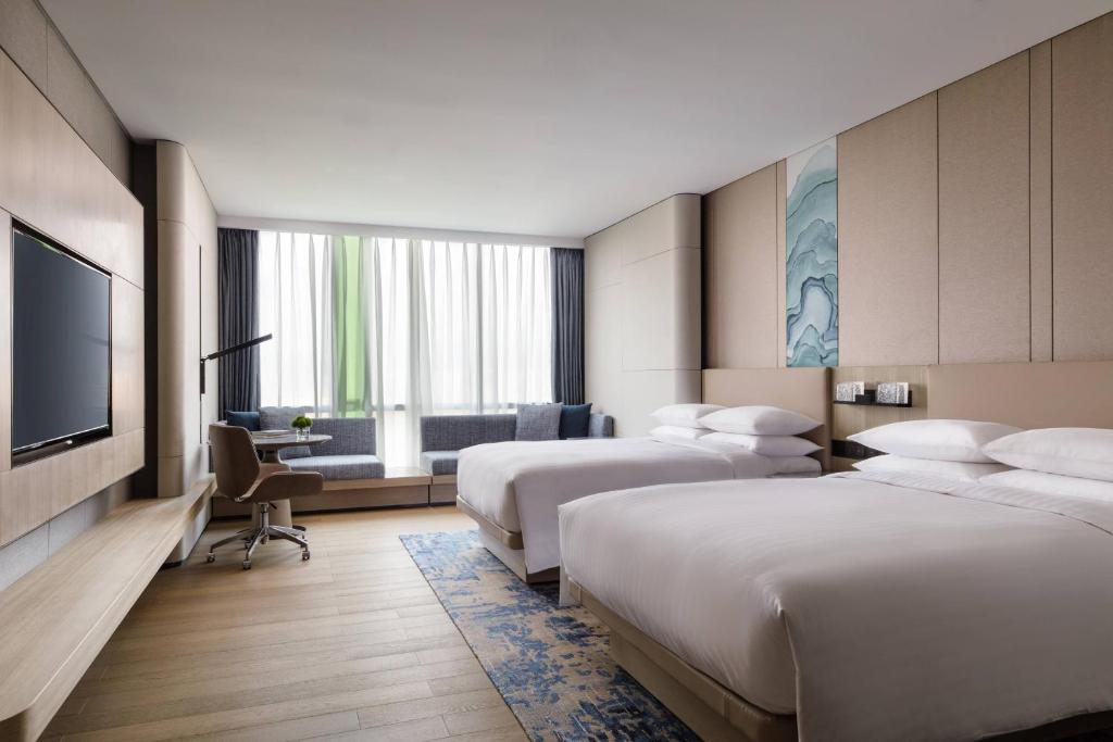 Postel nebo postele na pokoji v ubytování Courtyard by Marriott Shenzhen Northwest