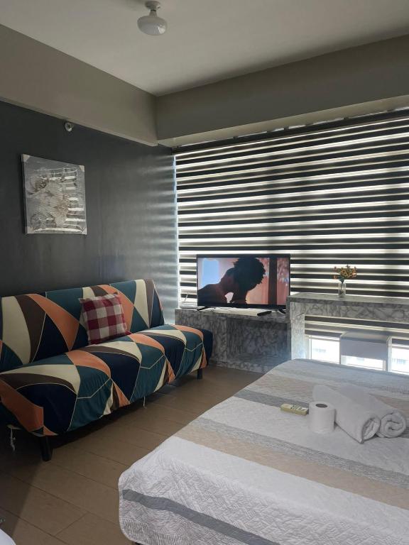 Postel nebo postele na pokoji v ubytování Henry's Newport Condotel