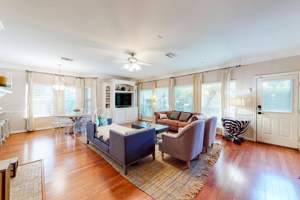 a living room with a couch and a table at Family-Friendly City Living in Houston