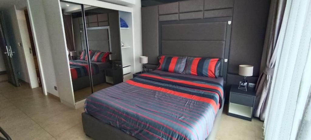 Ένα ή περισσότερα κρεβάτια σε δωμάτιο στο Central Pattaya Apartments