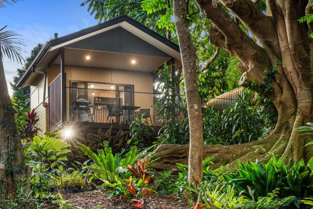 a house in the middle of a garden at Jandar Retreat Maleny in Maleny