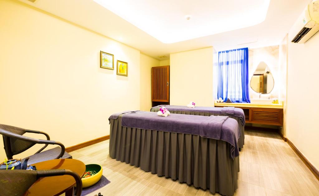 Postel nebo postele na pokoji v ubytování Avatar Danang Hotel