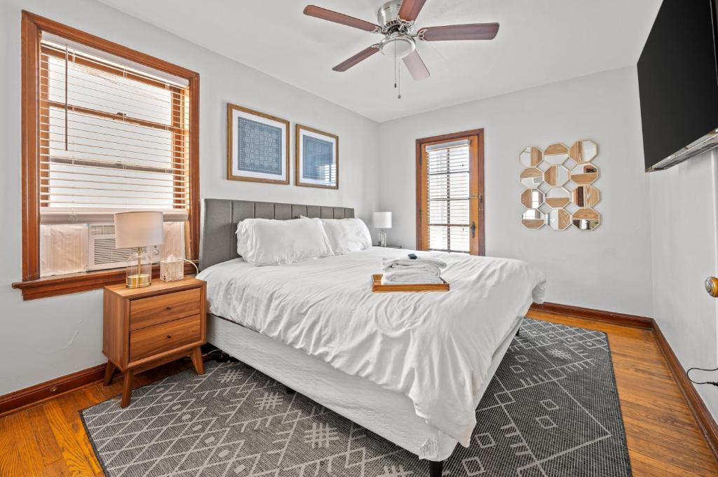 a bedroom with a bed and a ceiling fan at 1 bedroom-City Livin in Saint Louis