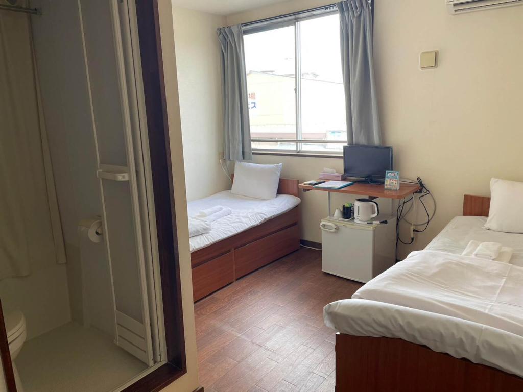Giường trong phòng chung tại Southern Village Okinawa - Vacation STAY 09976v