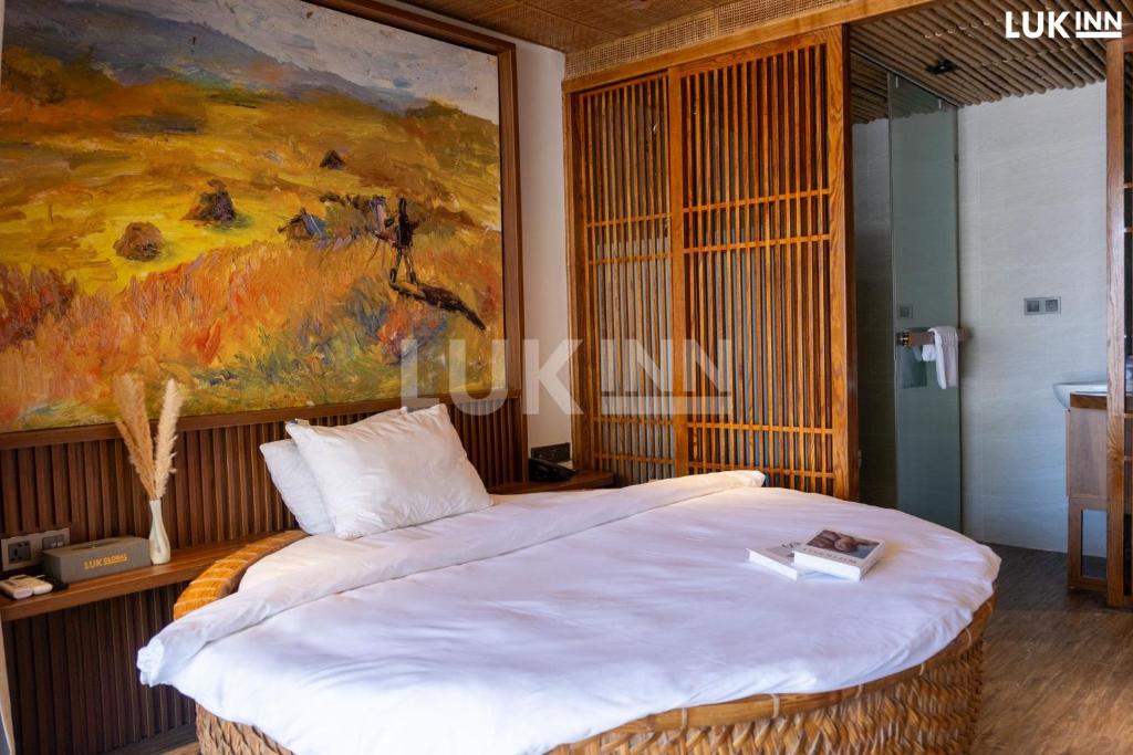 Postel nebo postele na pokoji v ubytování LUK Inn Hotel - An Thượng, Đà Nẵng