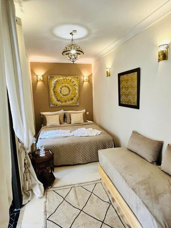 Postel nebo postele na pokoji v ubytování Riad Oasissime