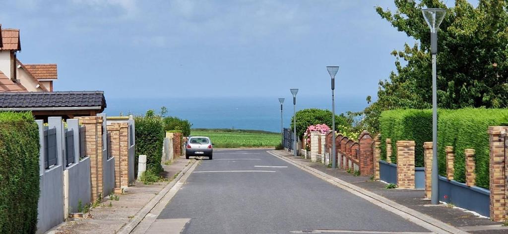 a car driving down a street with a fence at Maison 4 A 6 Personnes in Belleville-sur-Mer